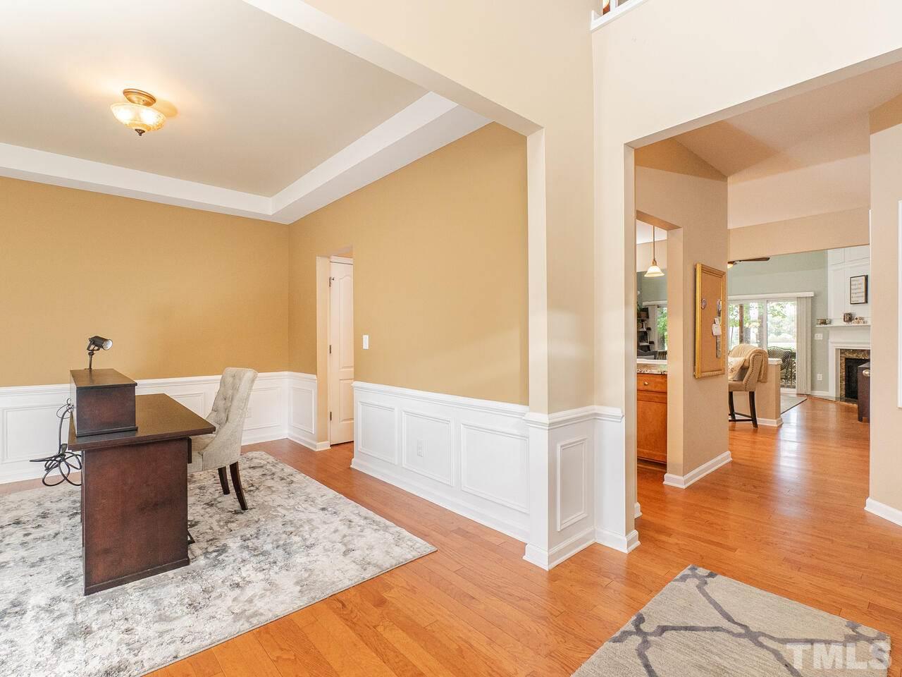 3901 Cathedral Bell Road Raleigh, NC 27614 - Photo 5 of 30 a workspace with furniture and wooden floor