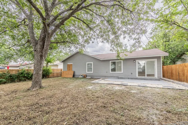 a house with trees in the background