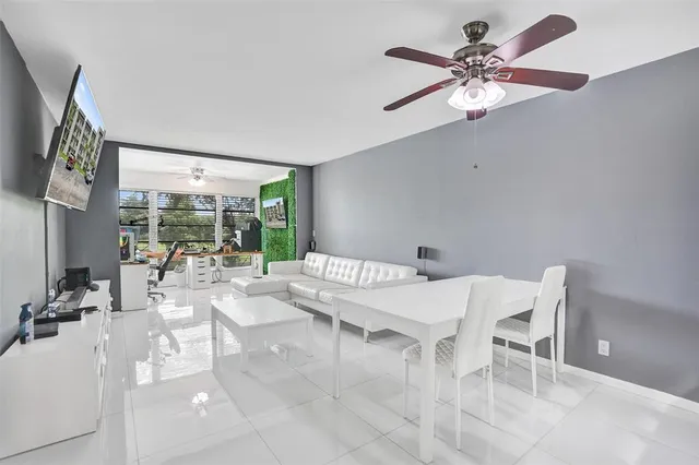 a view of a dining room with furniture wooden floor and chandelier