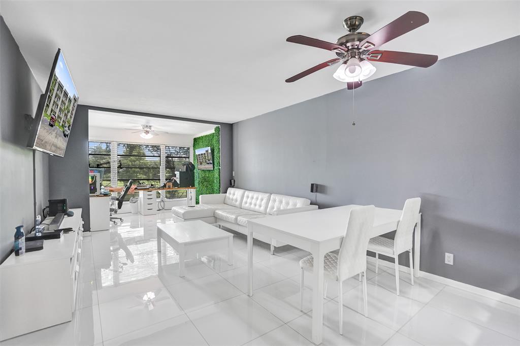 a view of a dining room with furniture wooden floor and chandelier