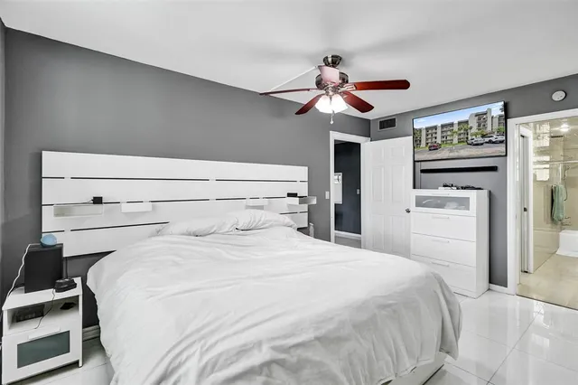 a bathroom with a granite countertop sink and mirror
