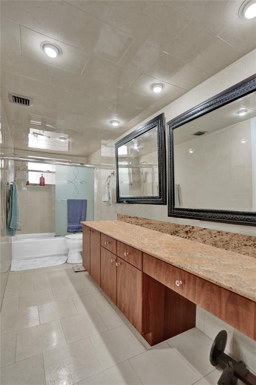 9235 Lagoon Place, Unit 207 Davie, FL 33324 - Photo 23 of 59 a large bathroom with a large tub and sink