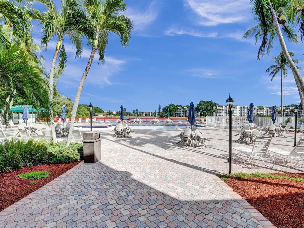 9235 Lagoon Place, Unit 207 Davie, FL 33324 - Photo 39 of 59 a view of a backyard patio and swimming pool