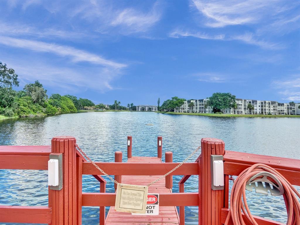 9235 Lagoon Place, Unit 207 Davie, FL 33324 - Photo 46 of 59 a outdoor view with a lake view in the background