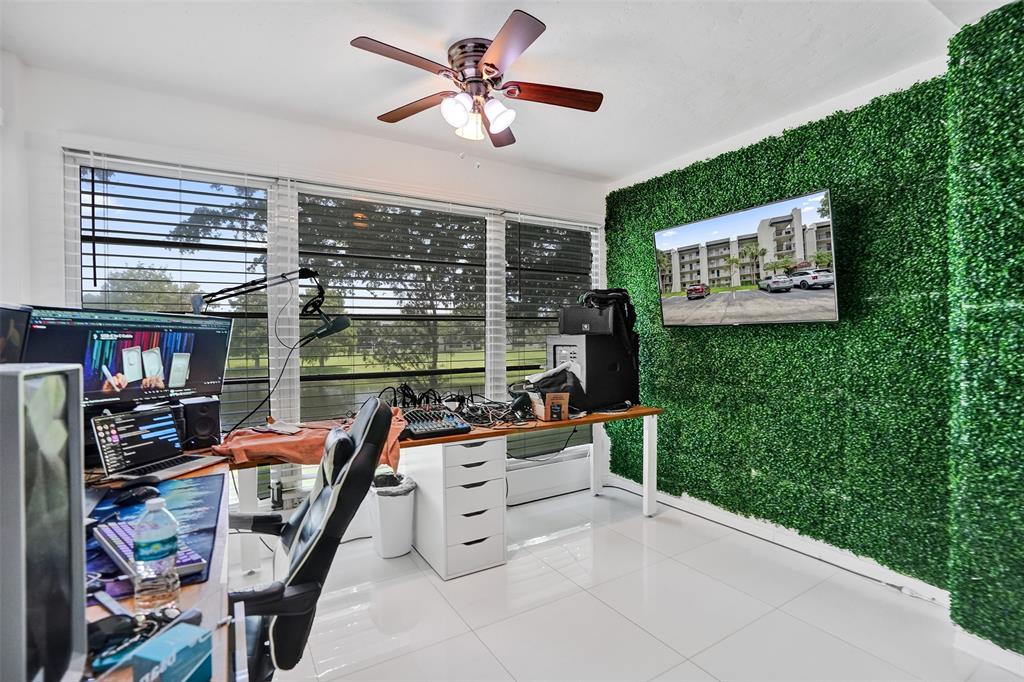 9235 Lagoon Place, Unit 207 Davie, FL 33324 - Photo 8 of 59 a view of a room with workspace and window
