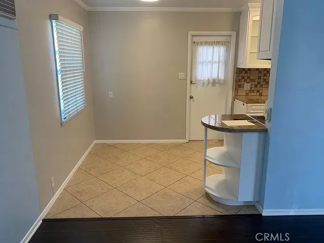 a kitchen with stainless steel appliances granite countertop a stove a refrigerator and a microwave