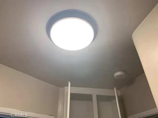 a view of a chairs and table in patio with a fire pit