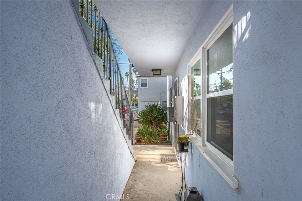 4401 Division Long Beach, CA 90803 - Photo 5 of 50 a view of a hallway with wooden floor and staircase