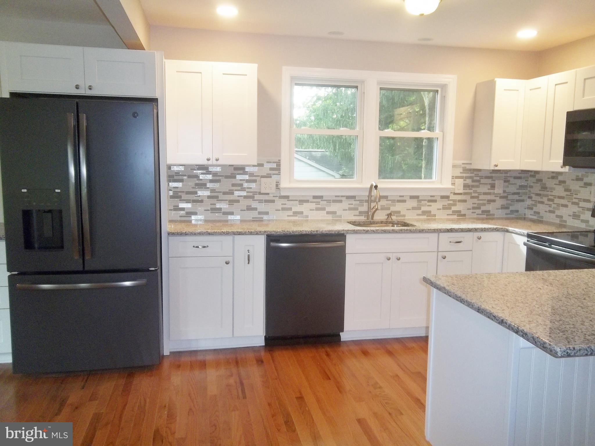 102 Barnes Corner Road Rising Sun, MD 21911 - Photo 9 of 29 New wood floors, black stainless appliances