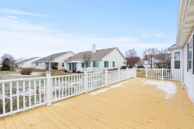 a view of a house with wooden fence