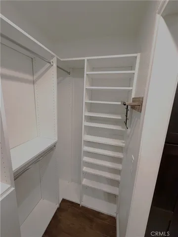 a view of an empty walk in closet