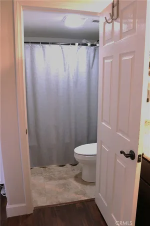 a bathroom with a shower and a mirror