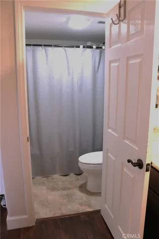 a bathroom with a shower and a mirror