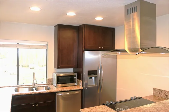 a kitchen with a sink and a refrigerator