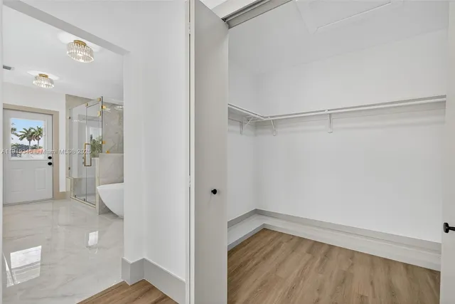 a bathroom with double sink and a mirror