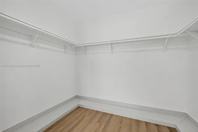 a bathroom with double sink and a mirror