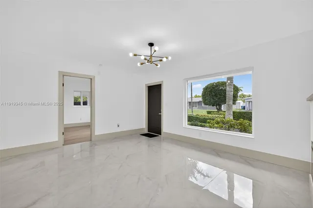 a bathroom with a toilet a sink a mirror and shower