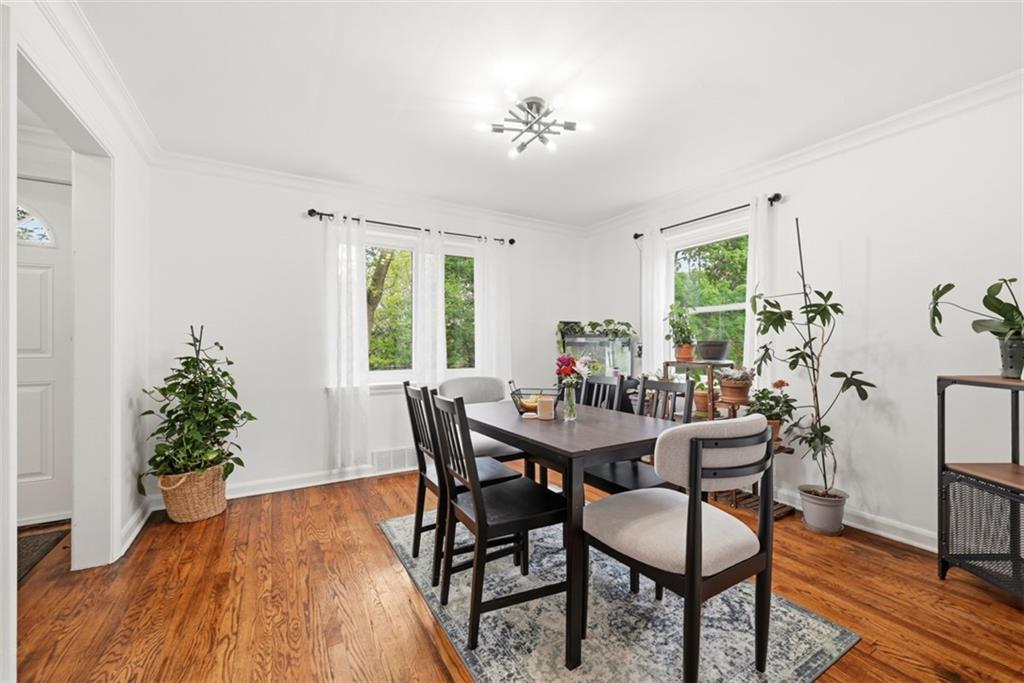 315 Woodside Road Pittsburgh, PA 15221 - Photo 11 of 46 a view of a dining room with furniture window and wooden floor