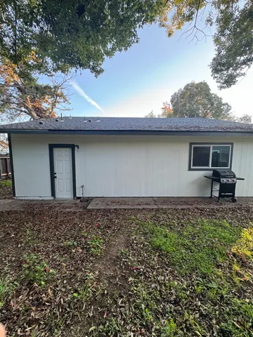 a backyard of a house with lots of green space