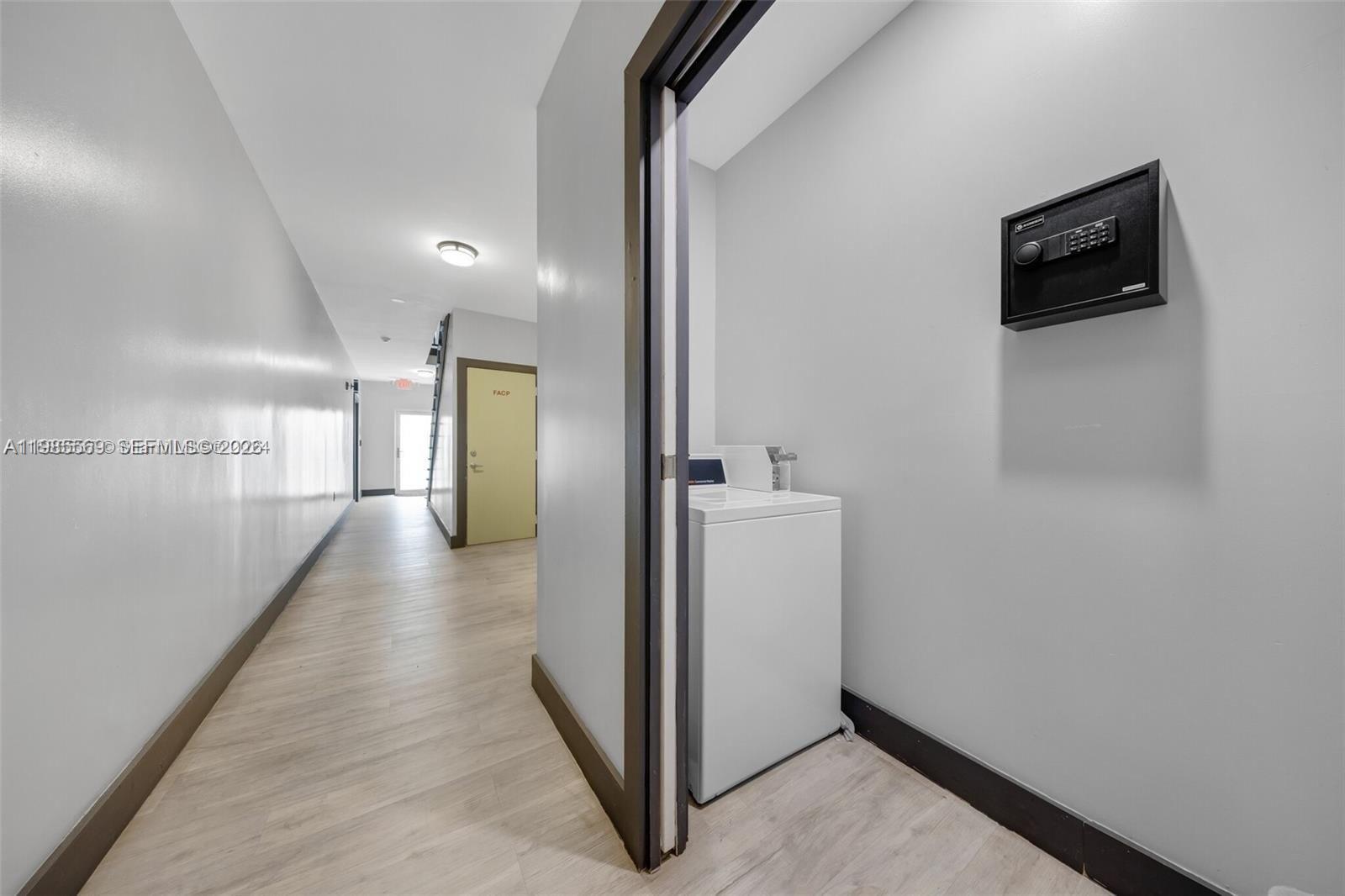 1020 Southwest 23rd Avenue, Unit 4 Miami, FL 33135 - Photo 13 of 17 a view of a hallway with workspace and a bathroom