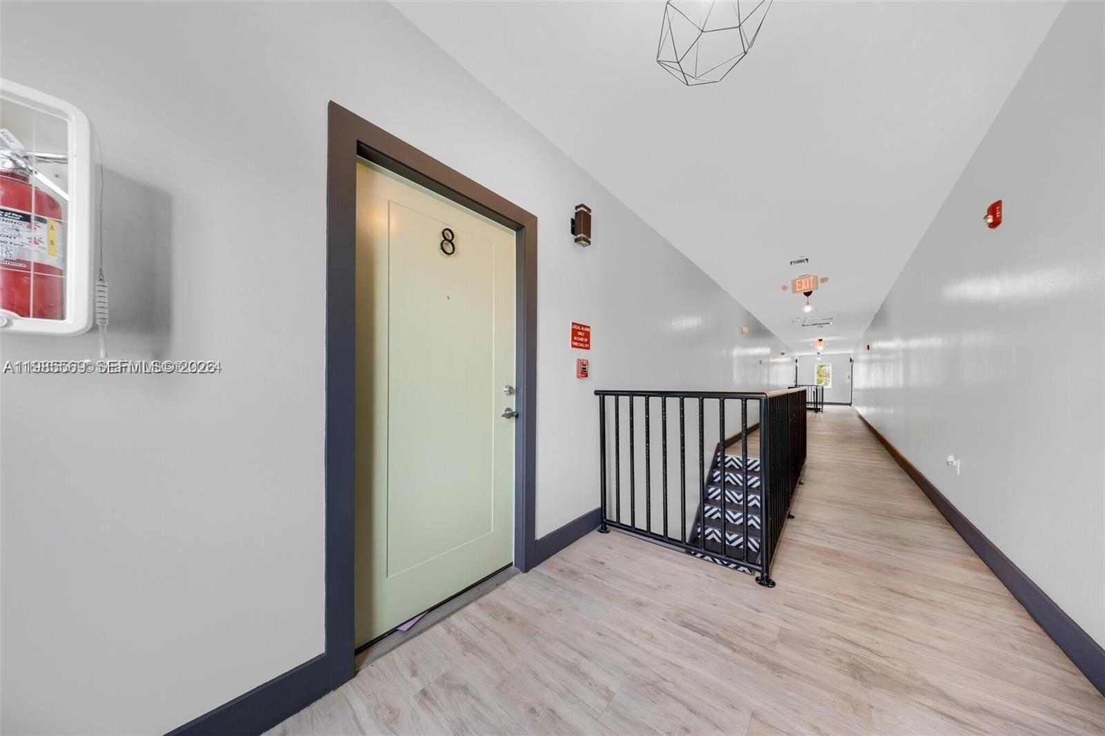 1020 Southwest 23rd Avenue, Unit 4 Miami, FL 33135 - Photo 15 of 17 a view of entryway with stairs and wooden floor