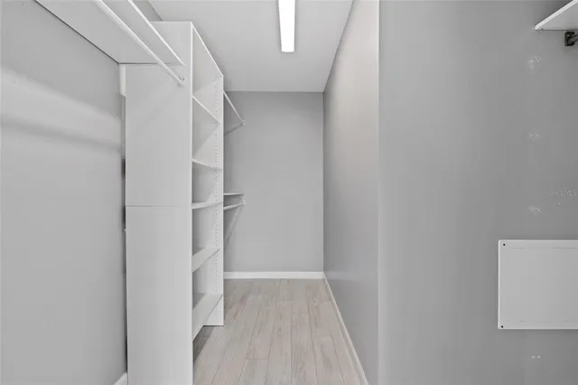 a view of an empty room with a window