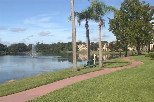 a swimming pool with outdoor seating and yard