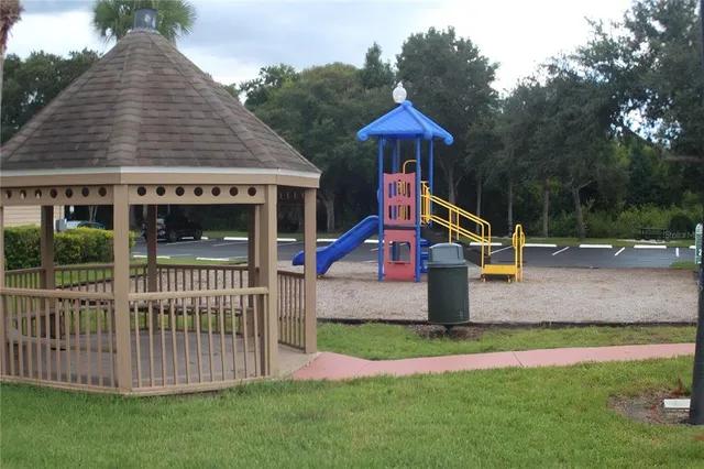 a outdoor dining space with furniture and a potted plant