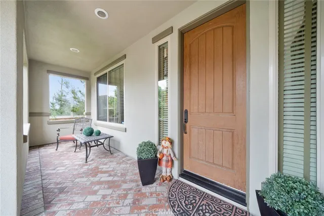 a living room with a floor to ceiling window and a floor to ceiling window
