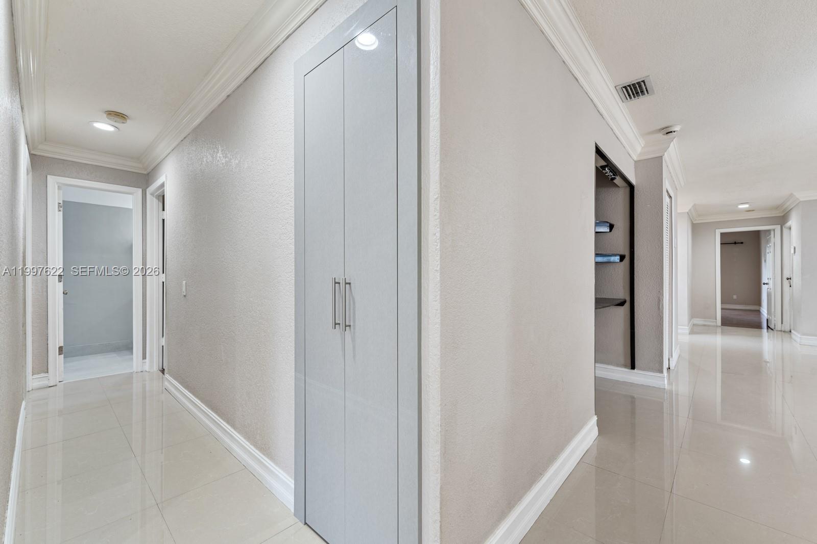 14912 Southwest 143rd Court, Unit 14912 Miami, FL 33186 - Photo 17 of 35 a view of a hallway with wooden floor