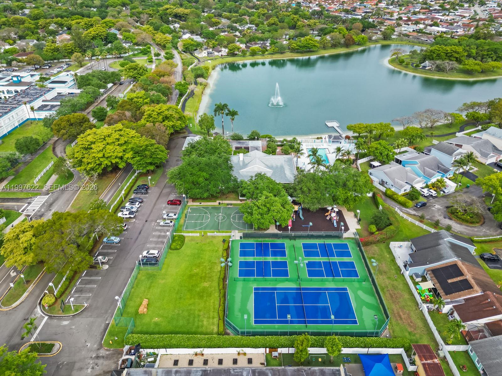 14912 Southwest 143rd Court, Unit 14912 Miami, FL 33186 - Photo 7 of 35 an aerial view of residential houses with outdoor space and swimming pool