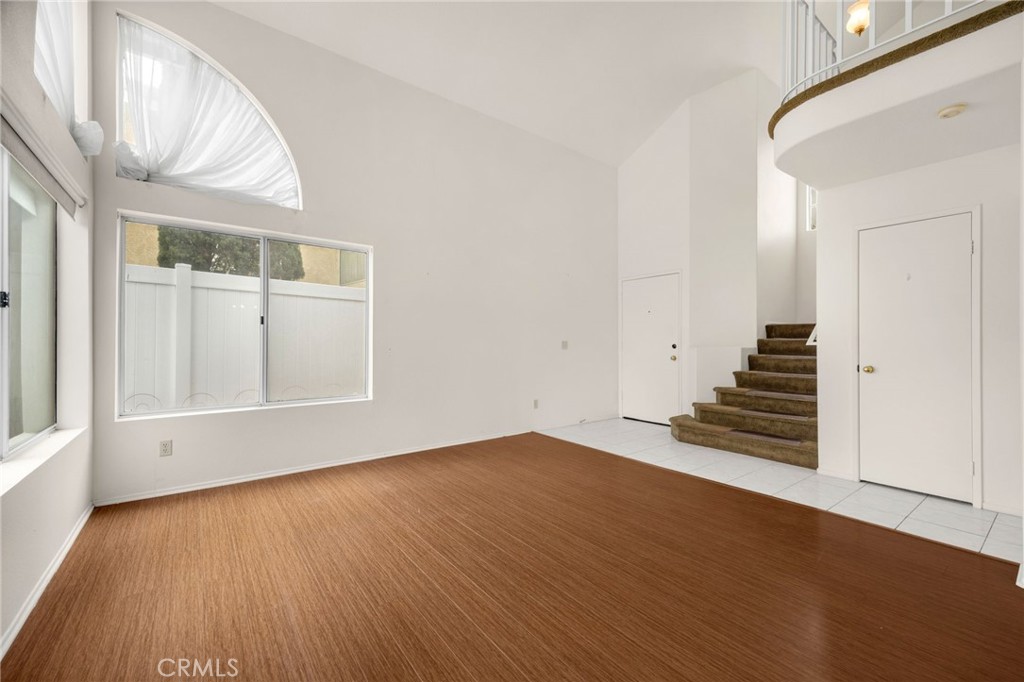 3631 Snowdrift Drive Riverside, CA 92503 - Photo 17 of 36 a view of an empty room with wooden floor and a window