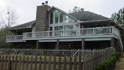 6085 Jesse Medley Road Crestview, FL 32539 - Photo 1 of 1 a front view of a house with a balcony