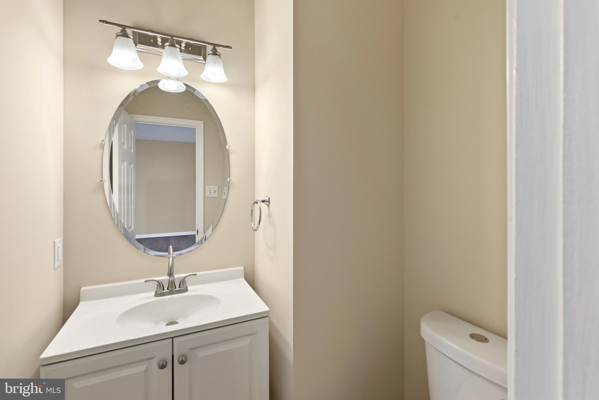 4704 Denview Way Baltimore, MD 21206 - Photo 13 of 42 a bathroom with a sink and a mirror