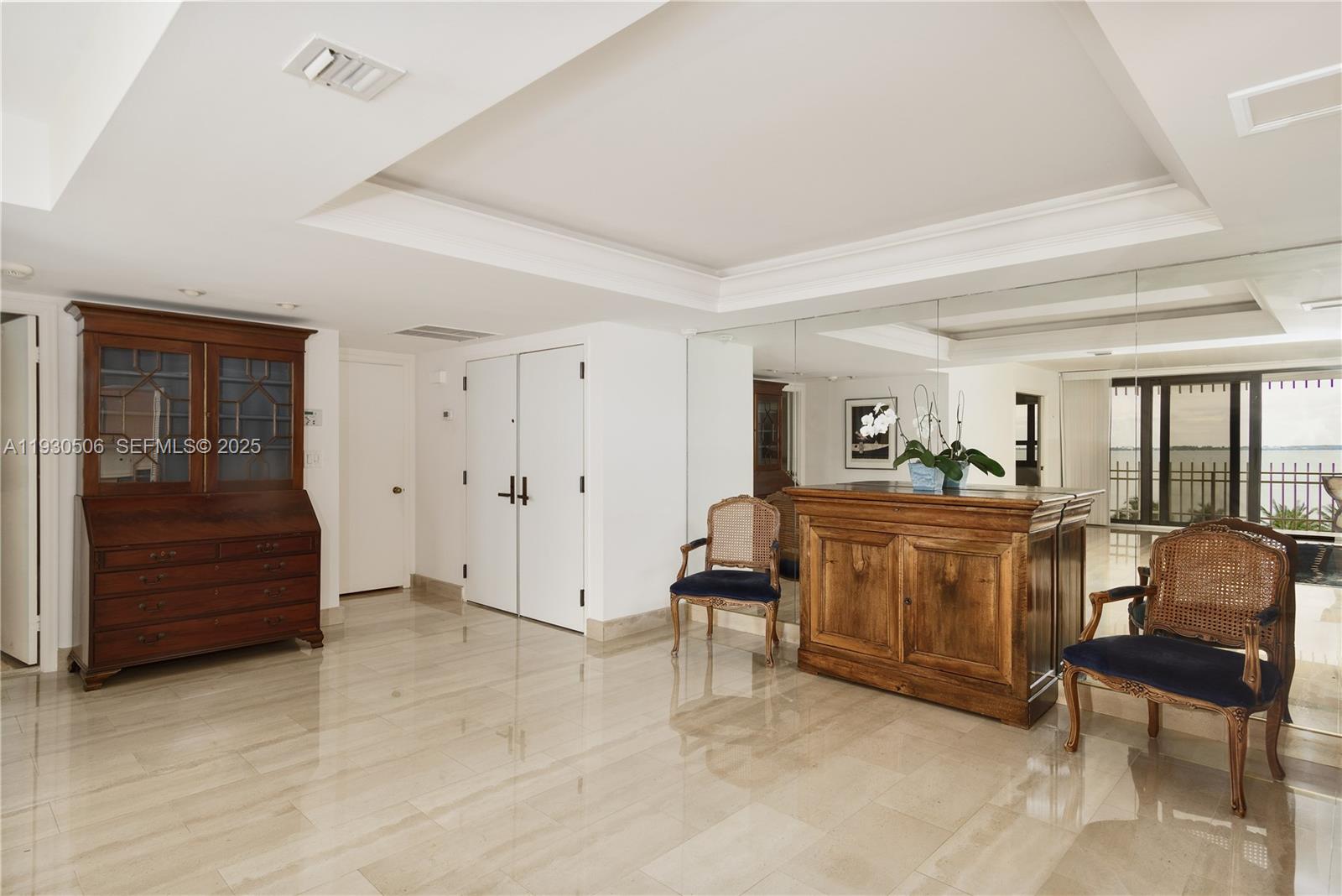2 Grove Isle Drive, Unit B703 Miami, FL 33133 - Photo 3 of 11 Foyer/Dining Room