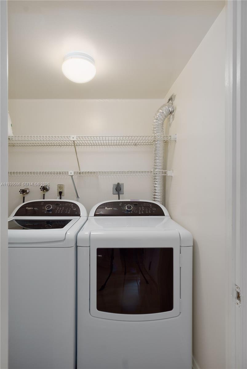 2 Grove Isle Drive, Unit B703 Miami, FL 33133 - Photo 9 of 11 In unit laundry