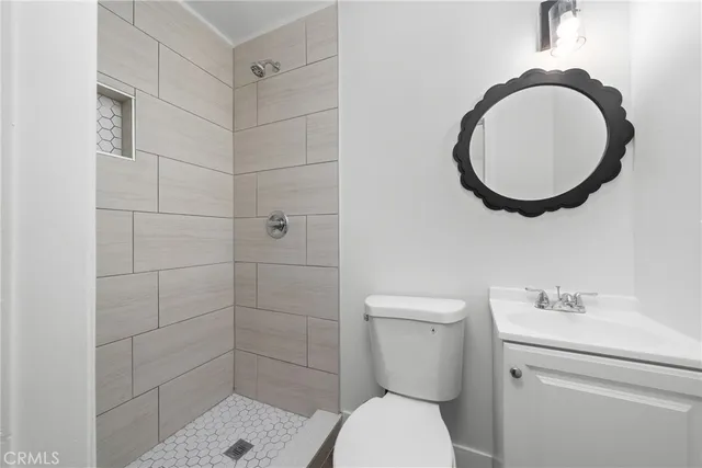 a bathroom with a toilet and a sink