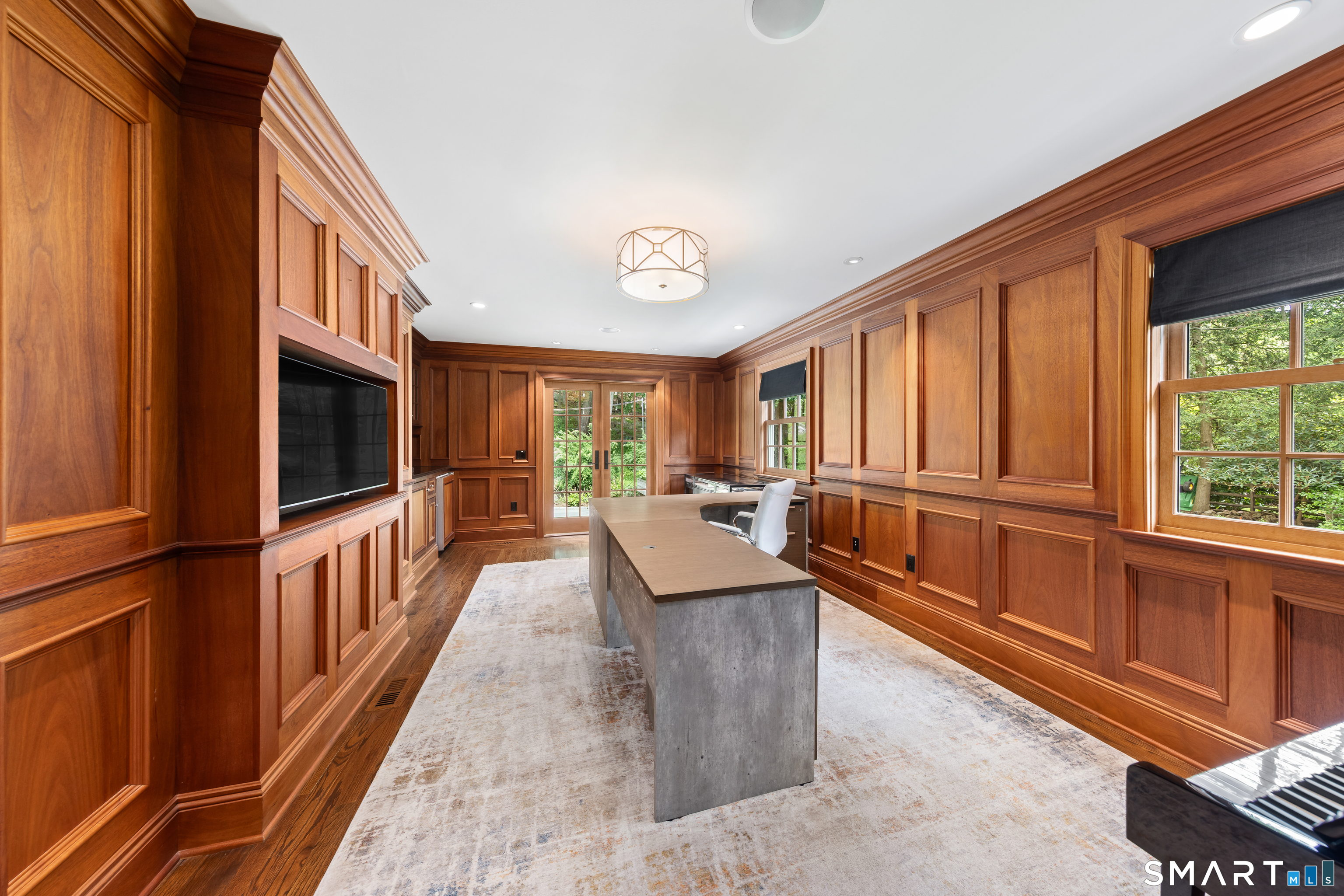 99 Hickok Road New Canaan, CT 06840 - Photo 13 of 39 a living room with furniture tv and a window