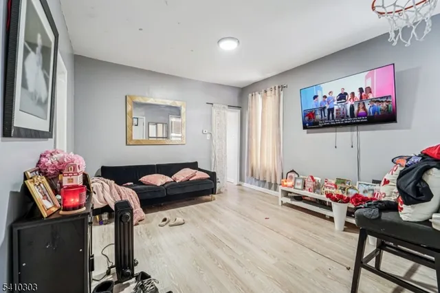 a bedroom with furniture and a closet