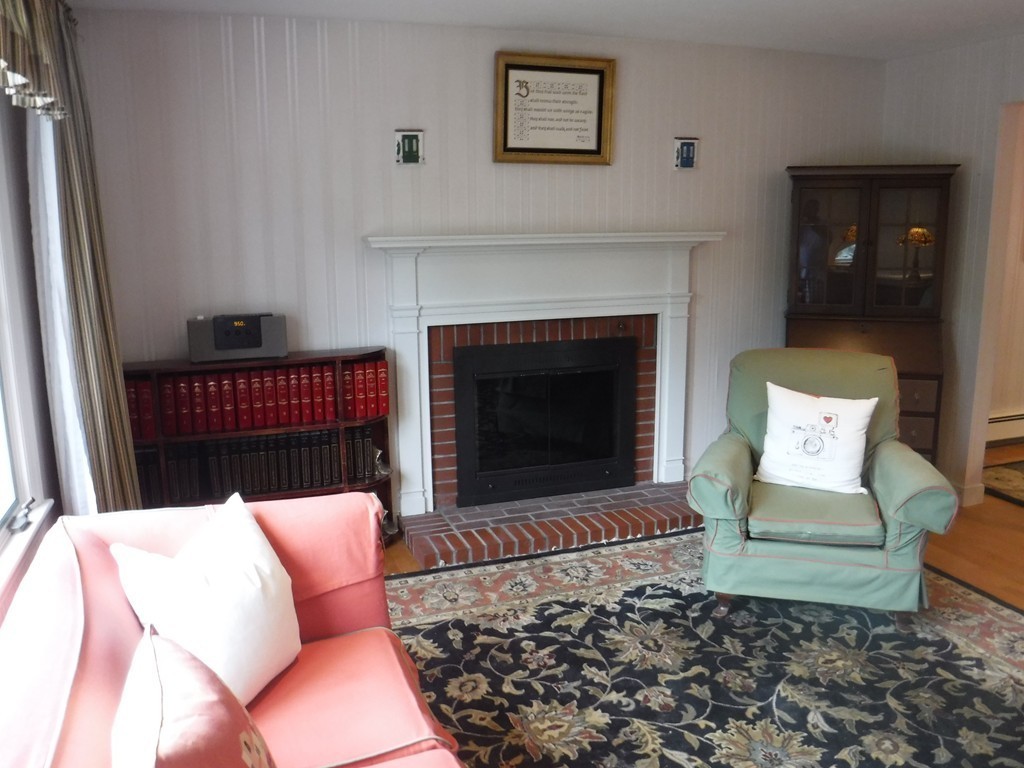 53 Ryder Road Weymouth, MA 02190 - Photo 8 of 29 a living room with furniture and a fireplace
