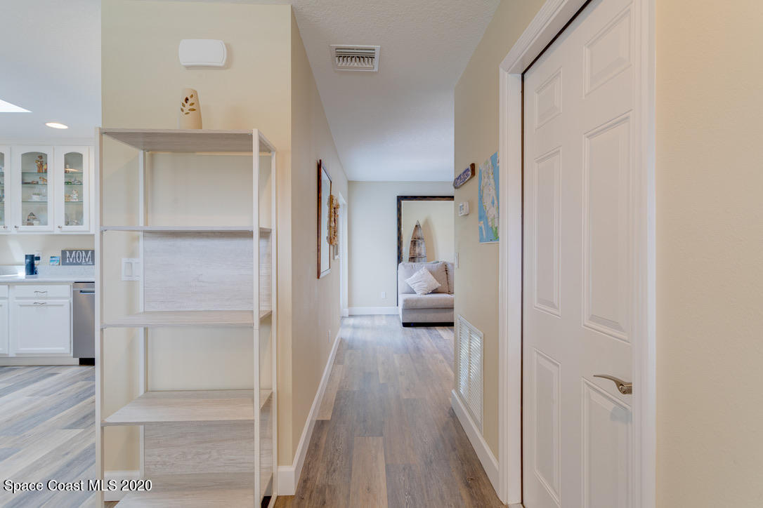 898 Brunswick Lane Rockledge, FL 32955 - Photo 30 of 49 Hallway from Kit to Greatroom