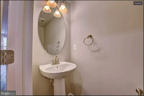 a bathroom with a sink and mirror