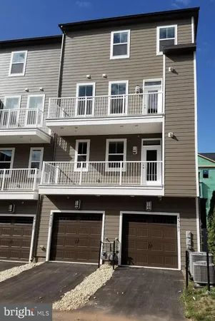a front view of a house with a garage