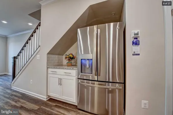 a kitchen with appliances and cabinets