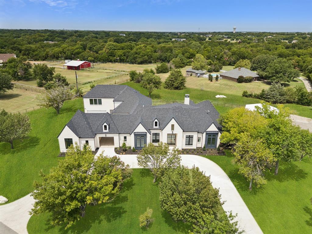 2157 Country Club Road Lucas, TX 75002 - Photo 1 of 1 an aerial view of residential houses with outdoor space and lake view