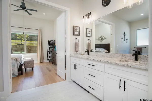 a living room with granite countertop furniture and a wooden floor