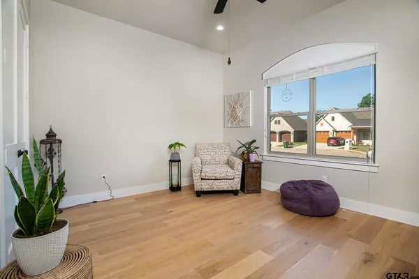 a bedroom with furniture and a potted plant