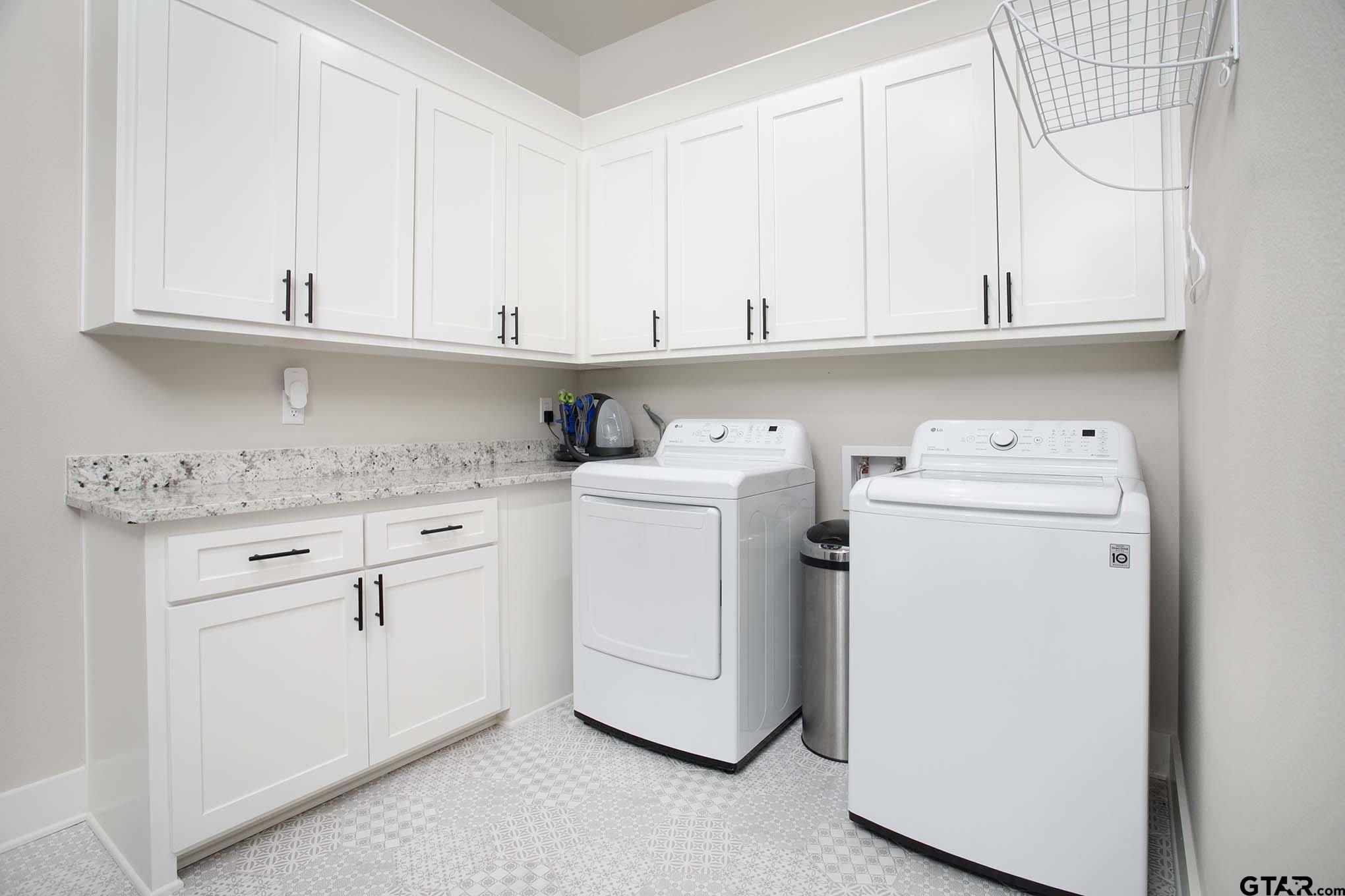 7434 Waterview Square Tyler, TX 75703 - Photo 28 of 33 a utility room with dryer and washer