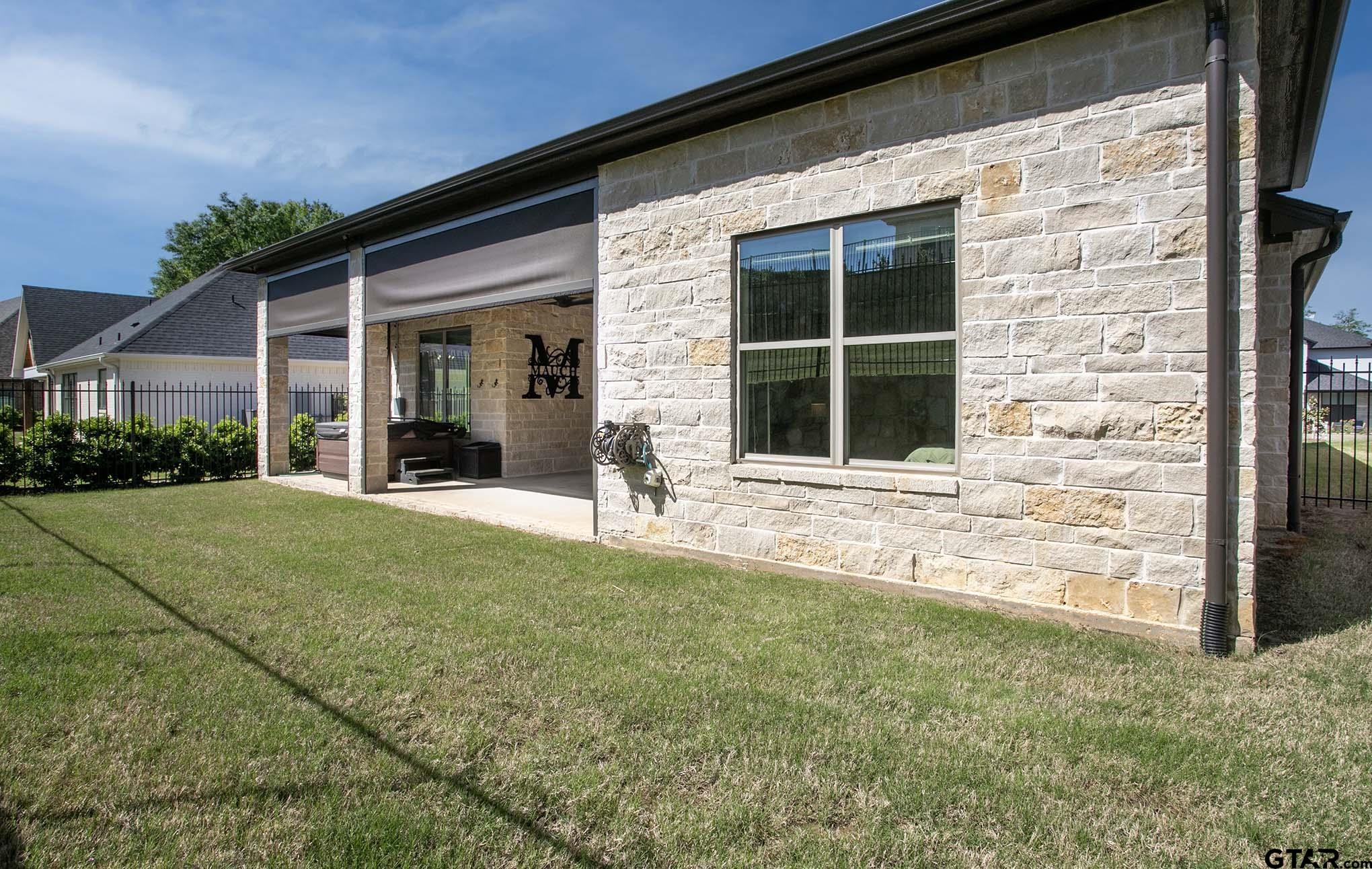 7434 Waterview Square Tyler, TX 75703 - Photo 30 of 33 a front view of a house with a yard