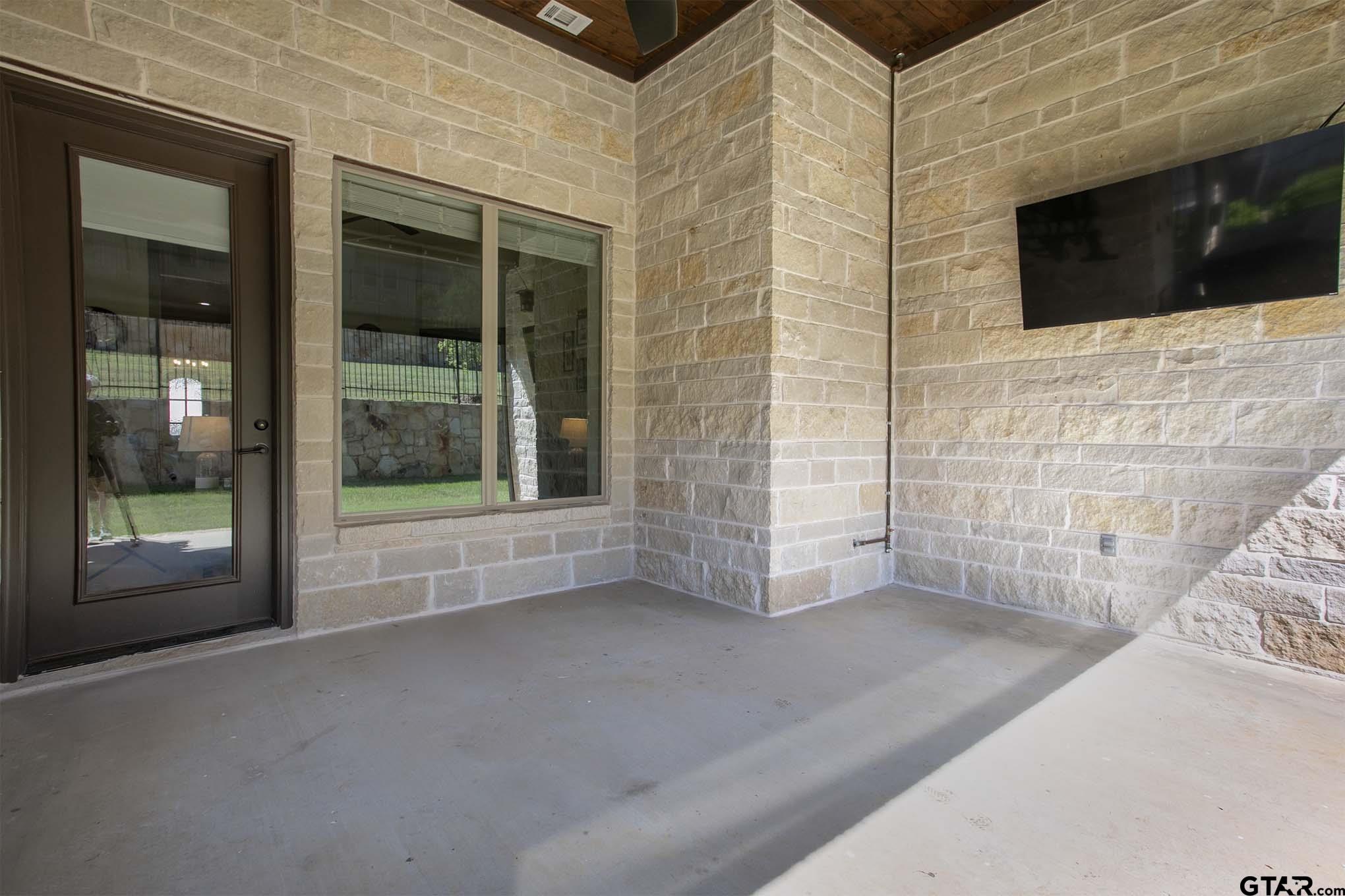 7434 Waterview Square Tyler, TX 75703 - Photo 31 of 33 a view of an empty room with a tv